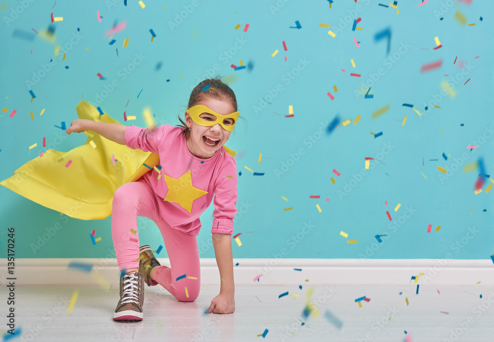 Fototapeta premium child plays superhero