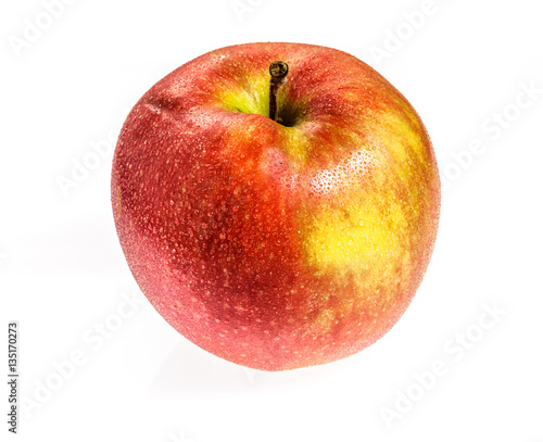 Water drops on a red Apple. Isolated on a white background.