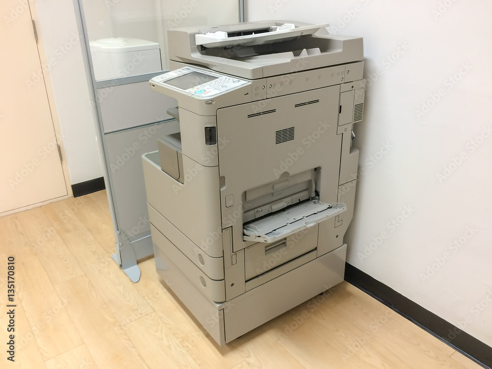 Photocopier / copy machine, printer and fax for office paper work with office background Photocopier / copy machine, printer and fax for office paper work with office background