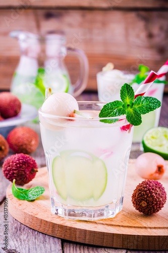 Cold fresh lemonade with lychee, lime and mint in glass