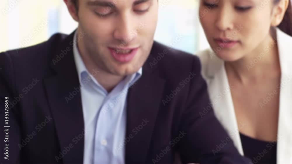 Office workers using digital tablet at meeting Office workers using digital tablet at meeting