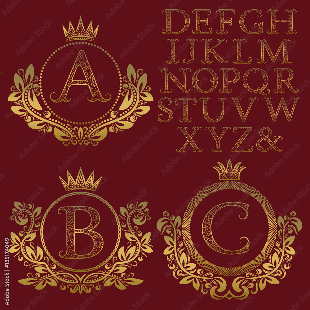 Vintage monogram kit. Golden patterned letters and floral coat of arms frames for creating initial logo in antique style.