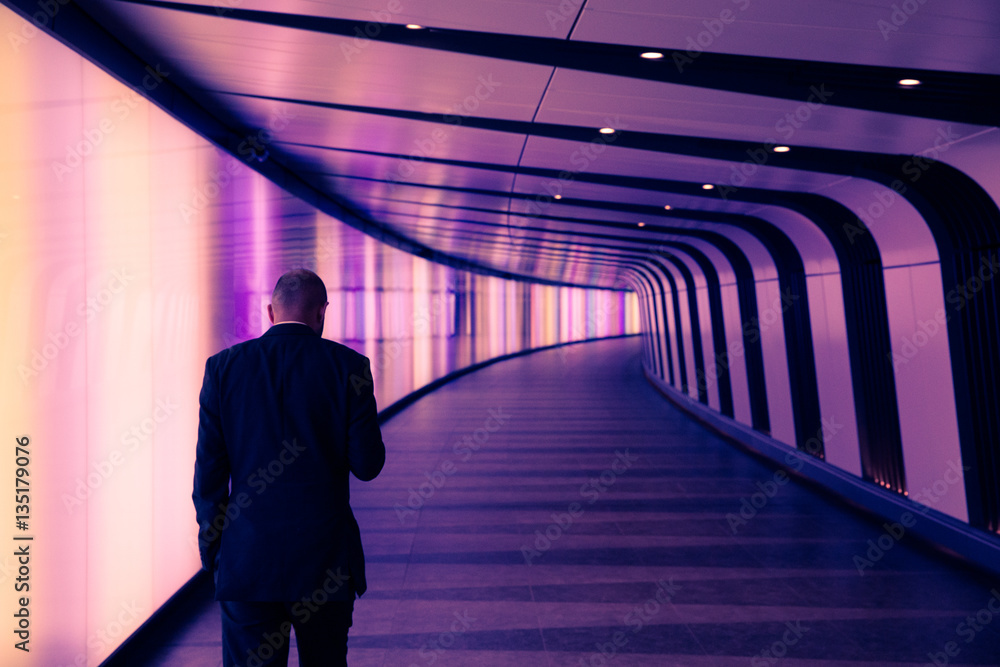 Businessman in modern tunnel Businessman in modern tunnel