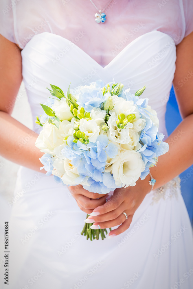 Wedding bouquet in the hands of the bride Wedding bouquet in the hands of the bride