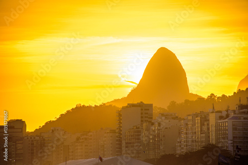 View of Two Brothers Dois Irmaos Mountain on the background of gold sunset from Copacabana beach  Rio de Janeiro  Brazil