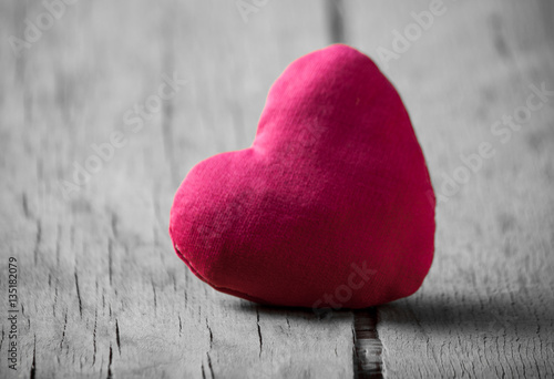 Heart made of cloth on wood desk