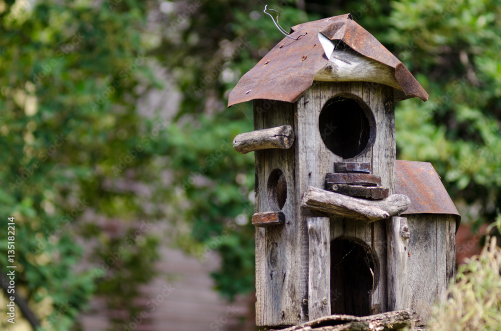 Rugged bird house made of wood and metal