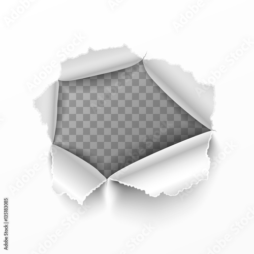 Torn hole in white sheet of paper