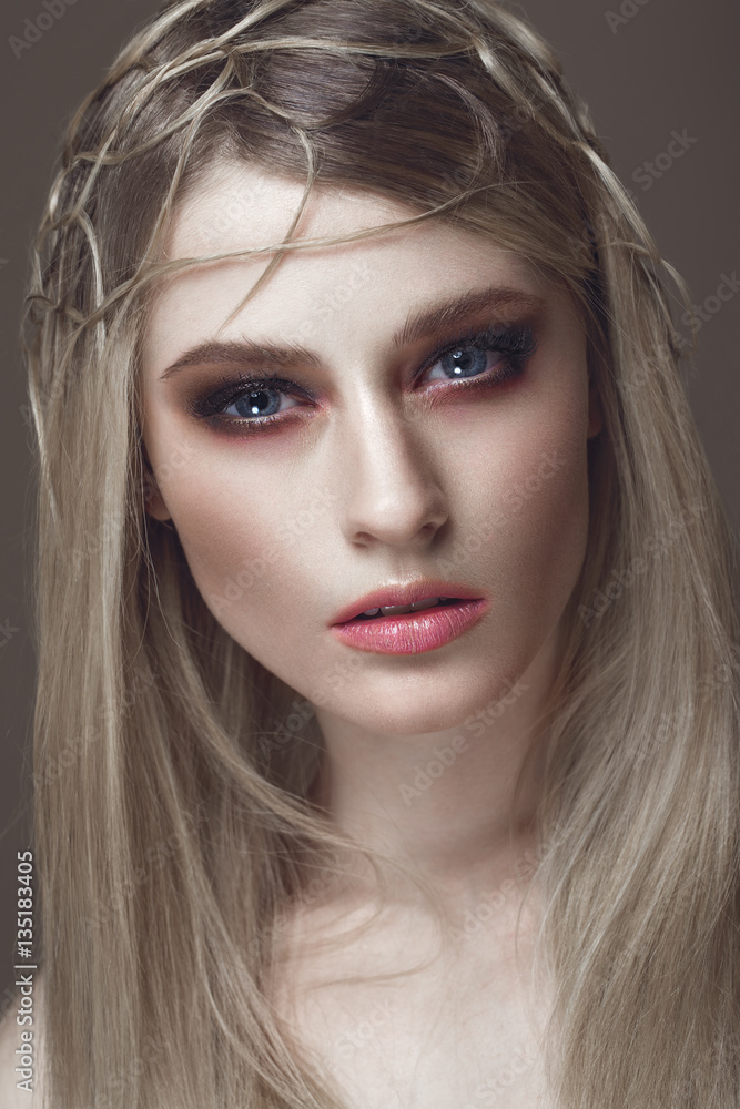 Beautiful fashion woman with creative make-up and hairstyle. The beauty of the face. Photos shot in the studio. Beautiful fashion woman with creative make-up and hairstyle. The beauty of the face. Photos shot in the studio.