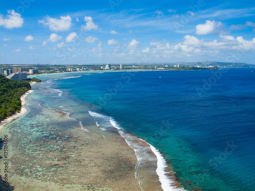 Blue coral and ocean in a tropical island (Guam)　南の島（グアム）の青空のしたの海とサンゴ礁 © Hideomi