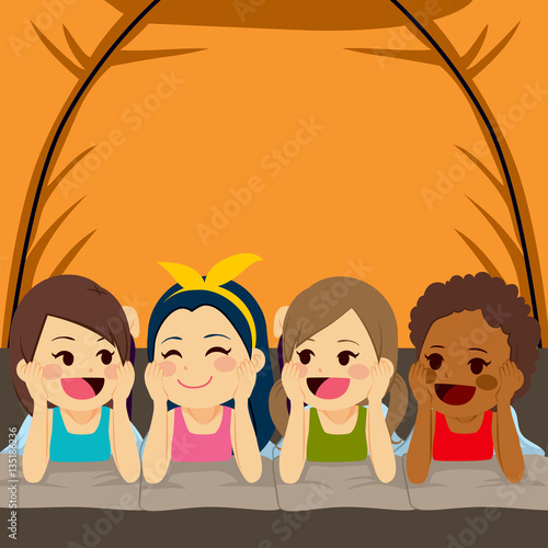 Four little cute girls friends camping inside tent at night