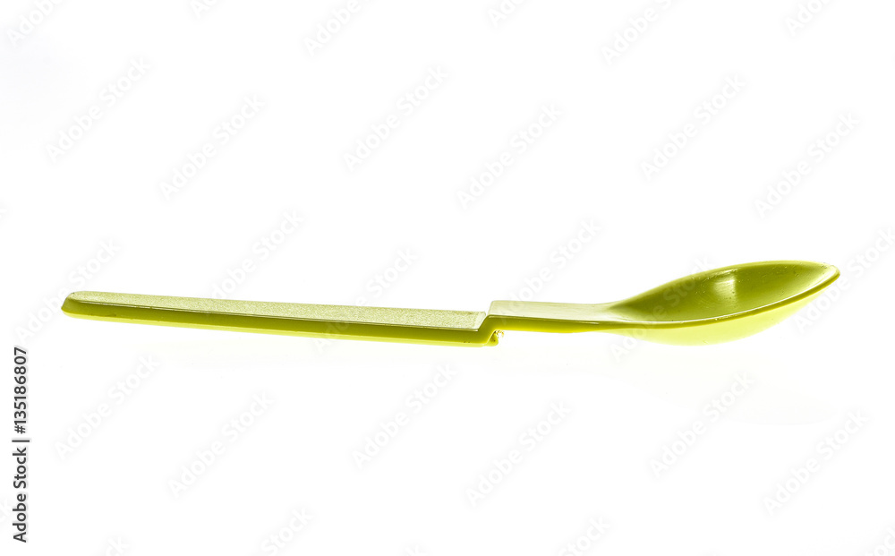 Close-up of a plastic tableware spoon for babies and children. Close-up of a plastic tableware spoon for babies and children.