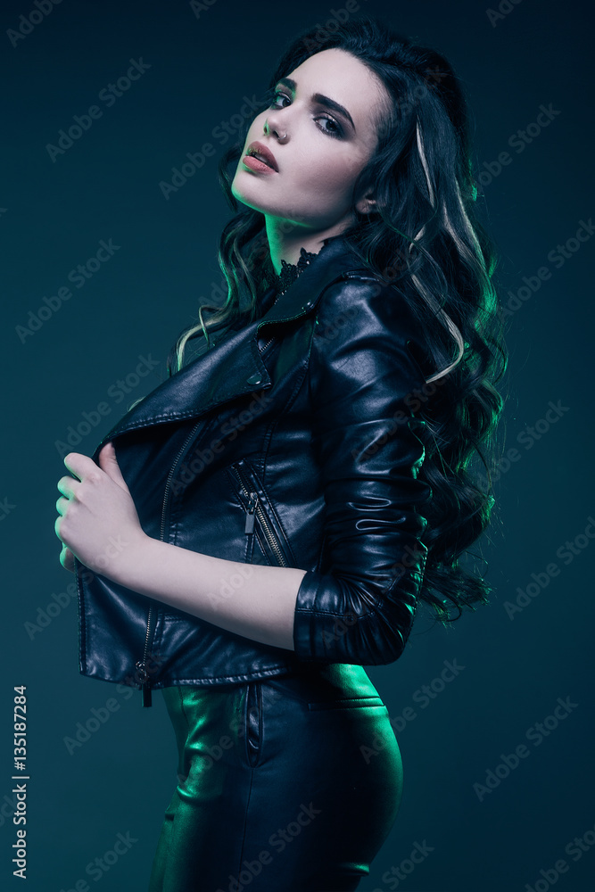 Young sexy girl with long hair in leather jacket Stock 写真 | Adobe Stock