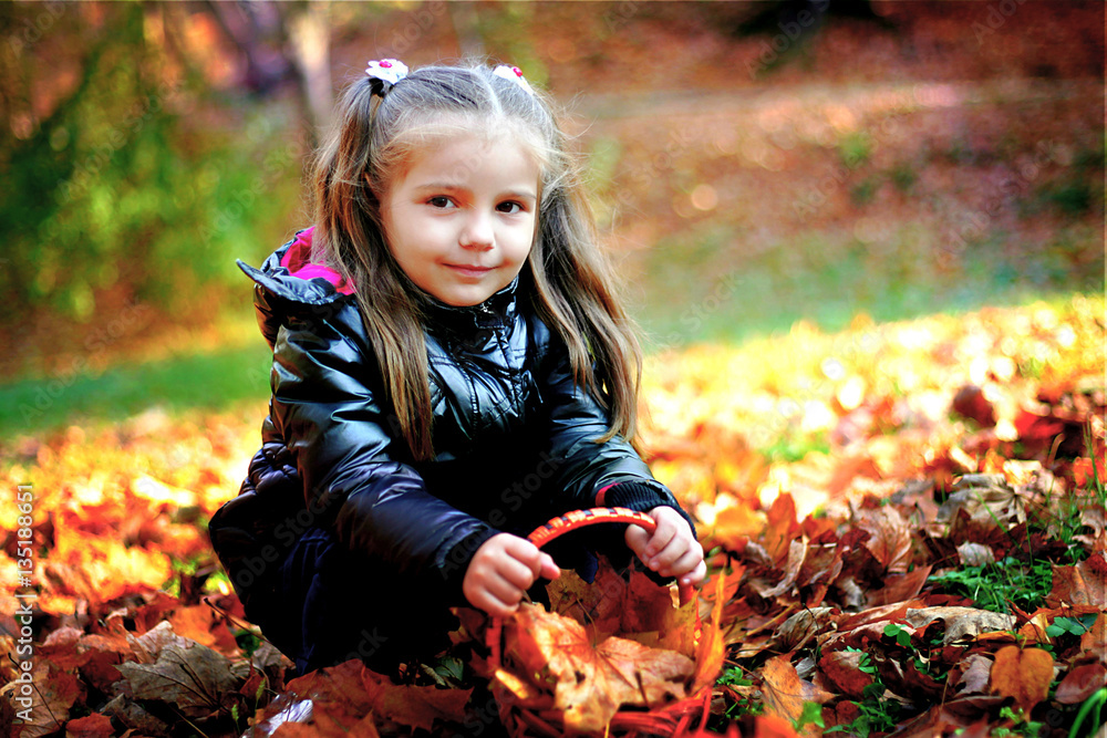 The little girl walks in the park The little girl walks in the park
