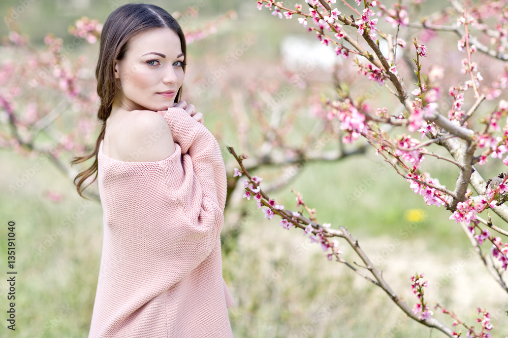 Beautiful woman in a spring garden 