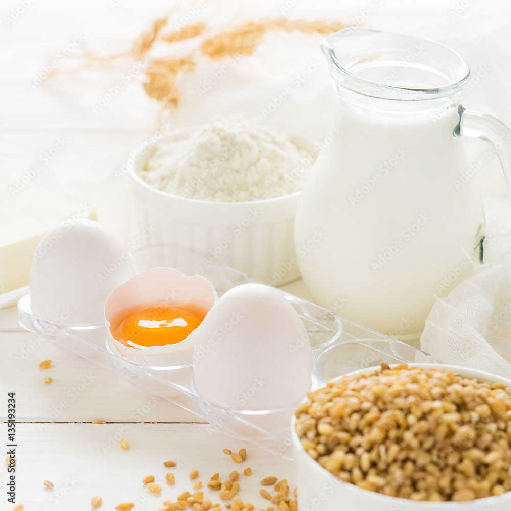 Ingredients for baking: flour, milk, wheat grain, butter and eggs on white wooden background. Selective focus
Ingredients for baking: flour, milk, wheat grain, butter and eggs on white wooden background. Selective focus