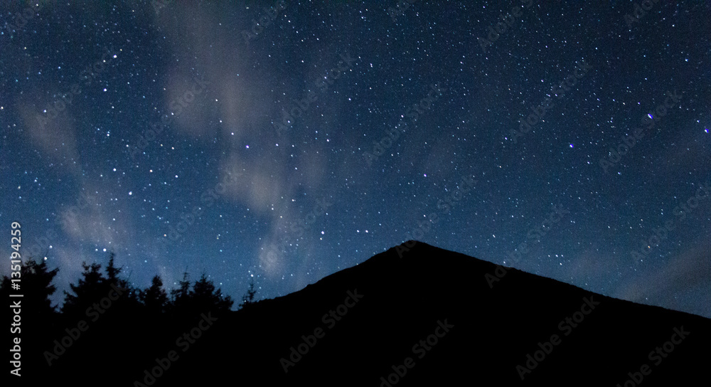 blue starry sky at the background of Ukrainian Mountain Hoverla