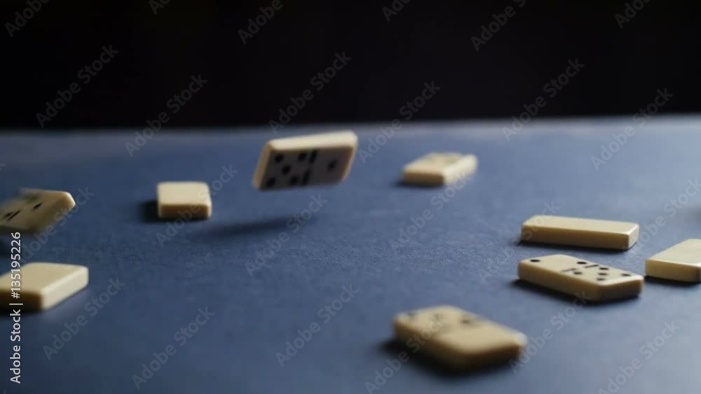 Dominoes falling on the table. Slow motion Dominoes falling on the table. Slow motion