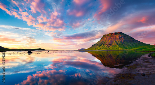 Colorful summer sunset with Kirkjufell Mountain in Grundarfjordu