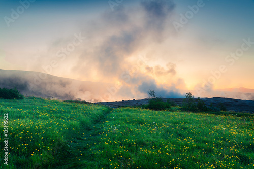 Foggy summer sunrise in Great Geysir valley