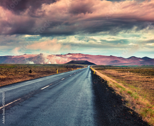Empty asphalt road with colorful cloudy sky. photo