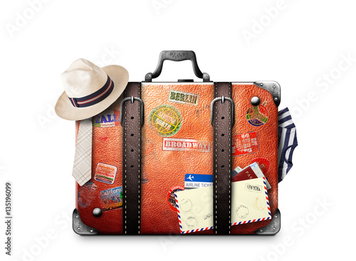 Retro suitcase of a traveler with travel stickers photo