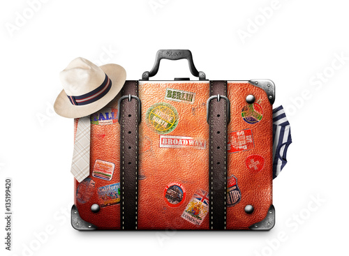 Retro suitcase of a traveler with travel stickers photo