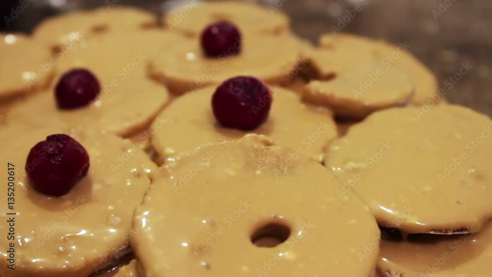 Woman decorate homemade cake with cherry