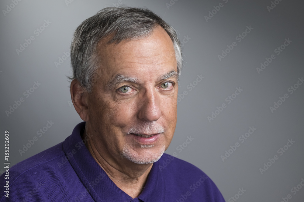 Portrait of a senior aged man smiling Portrait of a senior aged man smiling