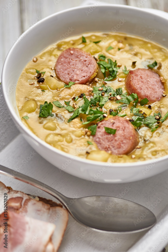 Traditional Dutch pea soup with smoked sausage and rye bread with bacon. Traditional Dutch pea soup with smoked sausage and rye bread with bacon.