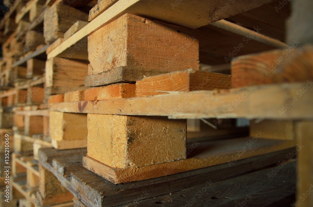 .wooden pallets. wood texture. Pallets stacked in piles. .wooden pallets. wood texture. Pallets stacked in piles.