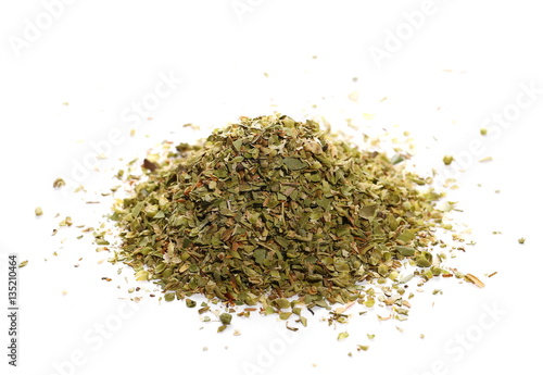 Pile of dried oregano leaves isolated on white background