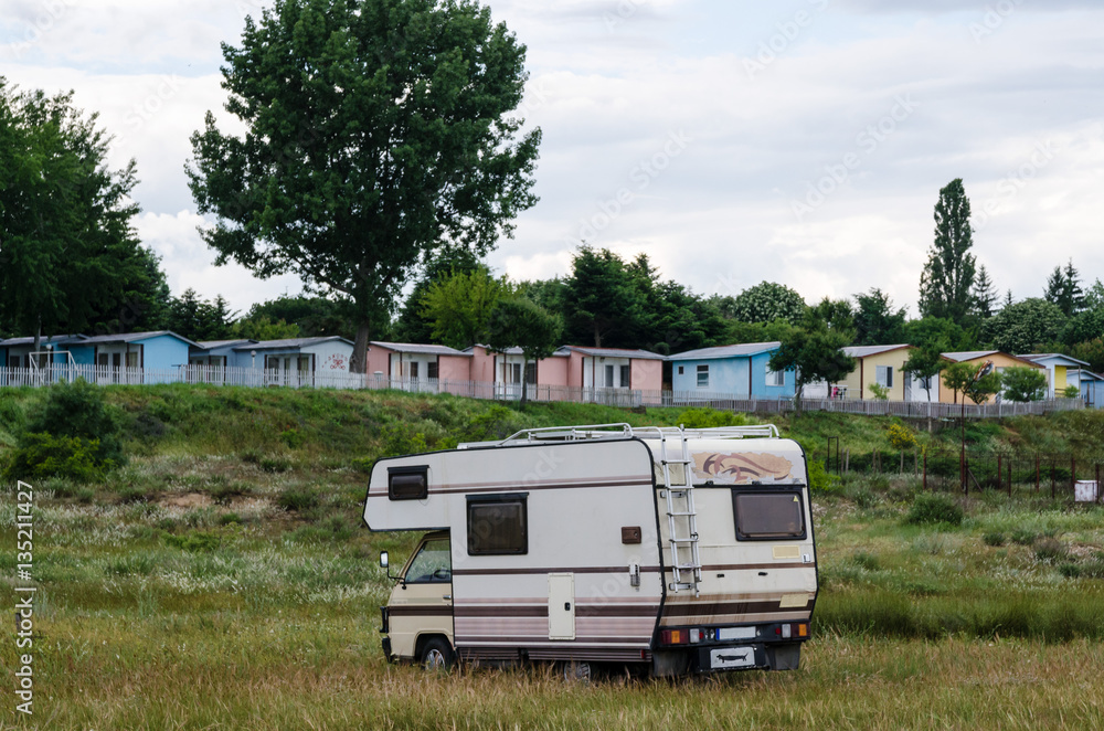 Camper camping on the beach in the summer vacation. Bungalows Camper camping on the beach in the summer vacation. Bungalows