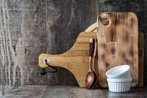Cooking utensils on wooden background
