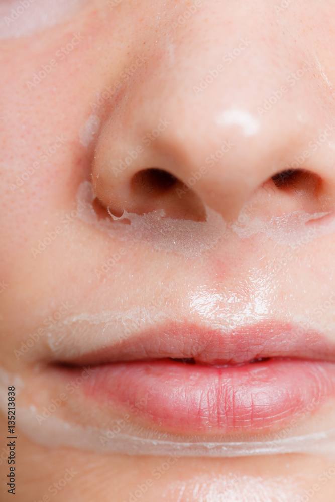 Fototapeta premium Close up woman in facial peel off mask.