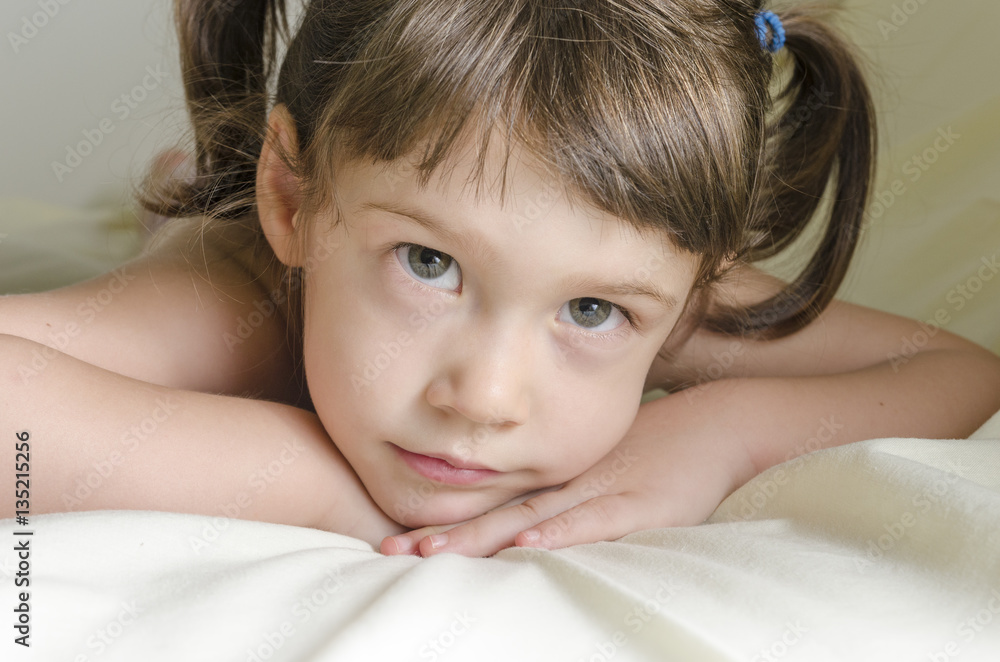 Portrait of a pretty little girl is daydreaming Portrait of a pretty little girl is daydreaming
