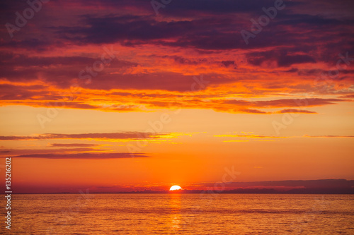 Amazing gold orange sky and water of Baltic sea at sunset © yegorov_nick
