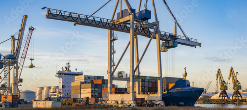 unloading a container ship in the sea port in Szczecin