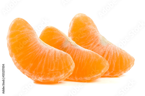 Three slices of tangerine isolated on white background