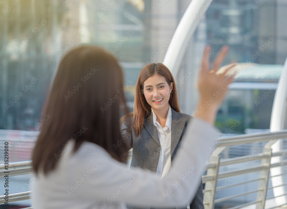 business woman greeting friends office area business woman greeting friends office area