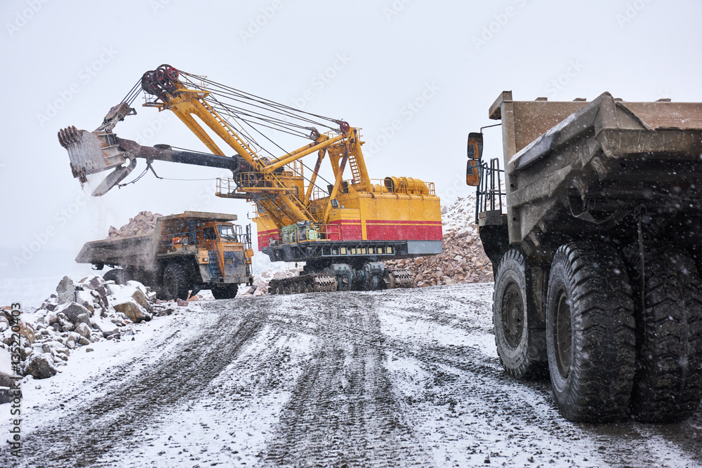 excavator loading granite or ore into dump truck at opencast excavator loading granite or ore into dump truck at opencast