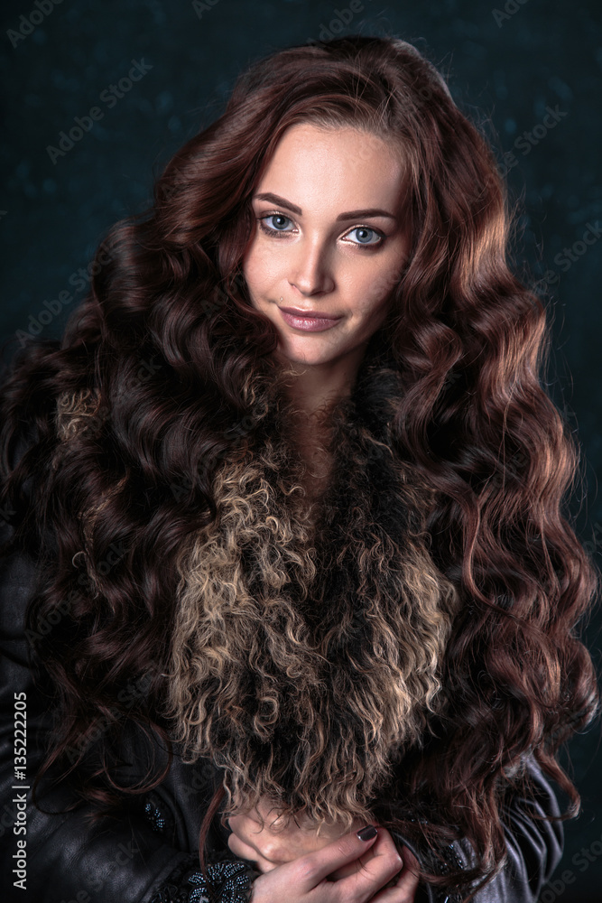 Young brunette woman with perfect natural makeup and hair style wearing furs. fashion beauty portrait Young brunette woman with perfect natural makeup and hair style wearing furs. fashion beauty portrait