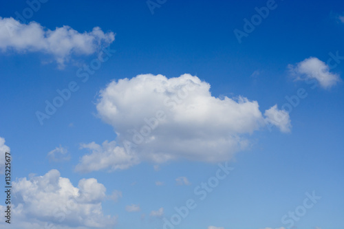 Fototapeta Naklejka Na Ścianę i Meble -  White shapeless clouds on the blue sky