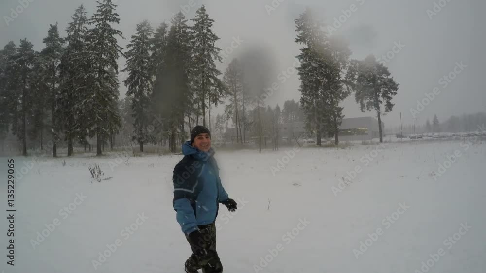 Man Doing Somersault For Fun in Winter Snowfall Man Doing Somersault For Fun in Winter Snowfall