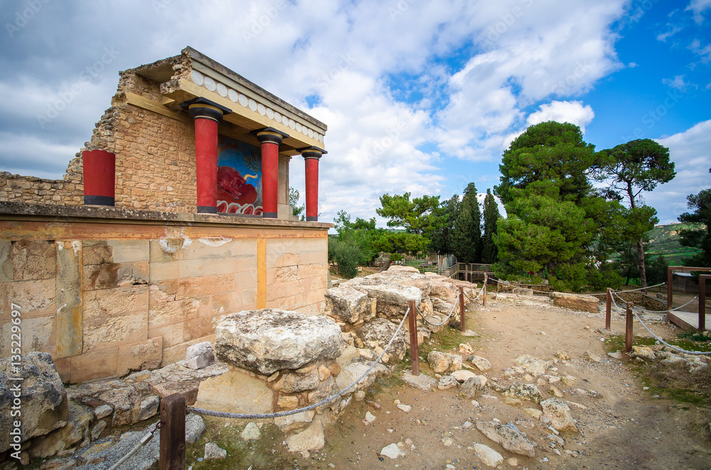 The North Entrance of the Palace with charging bull fresco in Knossos at Crete, Greece The North Entrance of the Palace with charging bull fresco in Knossos at Crete, Greece