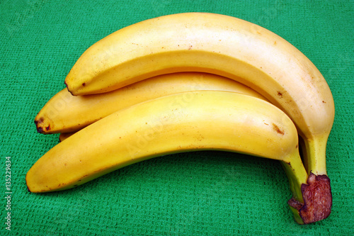 Fresh bananas on wooden board