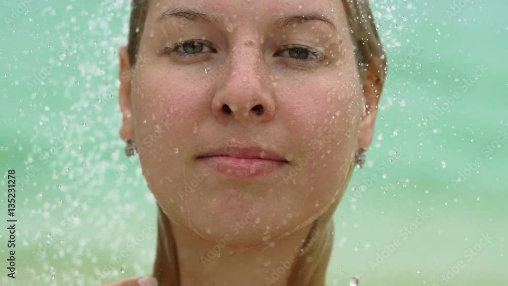 Sexy blonde woman taking outdoor shower slowmotion Sexy blonde woman taking outdoor shower slowmotion