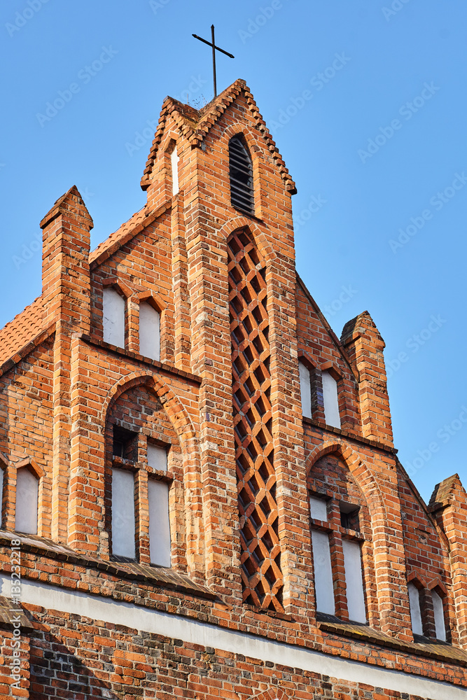 Fragment of the facade of the medieval Gothic church in Poznan.