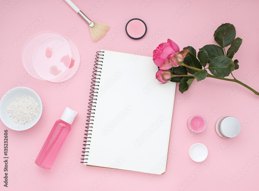 Natural cosmetic pink flat lay with flowers. Top view. Natural cosmetic pink flat lay with flowers. Top view.