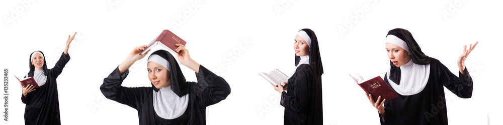 Pretty nun with Bible isolated on white Pretty nun with Bible isolated on white